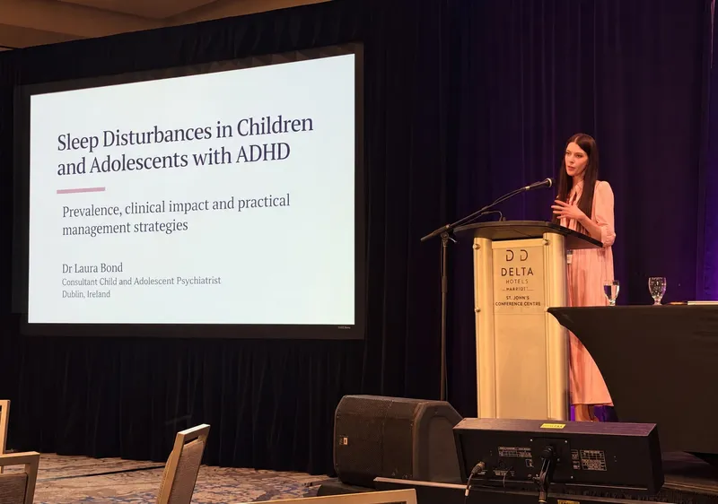 Dr Laura Bond presenting research at a conference